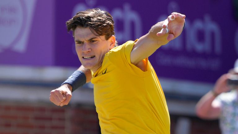 Jack Draper of Britain celebrates winning match point against Carlos Alcaraz of Spain during their men's singles match on day six of The Queen's Club tennis tournament, in London, Thursday, June 20, 2024. (AP Photo/Kirsty Wigglesworth)